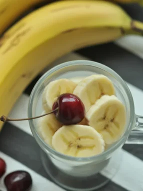 Kefir Banana Smoothie with frozen berries and peanut butter in a glass