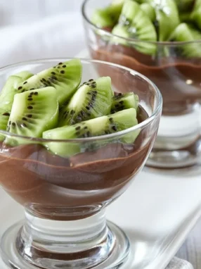 Delicious Kefir Chocolate Avocado Mousse topped with cocoa and chia seeds.