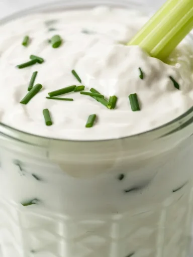 Yogurt-Kefir Creamy Dip served in a bowl with fresh herbs and vegetables.