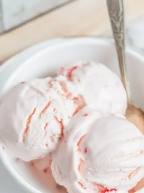 Delicious homemade Yogurt Kefir Ice Cream served in a bowl, garnished with fresh fruit.