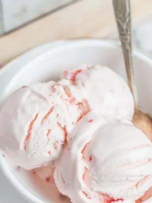 Delicious homemade Yogurt Kefir Ice Cream served in a bowl, garnished with fresh fruit.