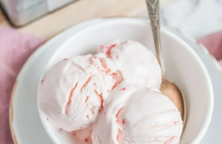 Delicious homemade Yogurt Kefir Ice Cream served in a bowl, garnished with fresh fruit.