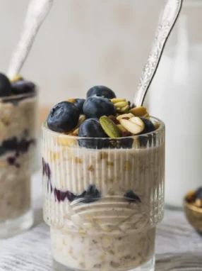 Yogurt-Kefir Overnight Oats in a mason jar with fruit and chia seeds.