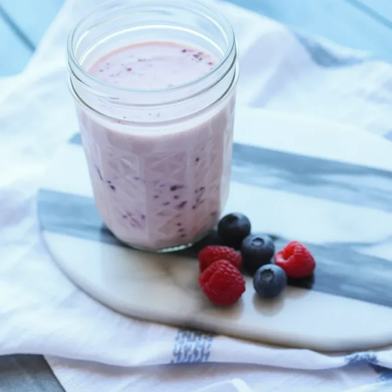 Yogurt-Kefir Protein Shake with bananas and berries in a blender.