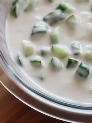 Homemade Yogurt-Kefir Salad Dressing with fresh herbs and tangy flavors.